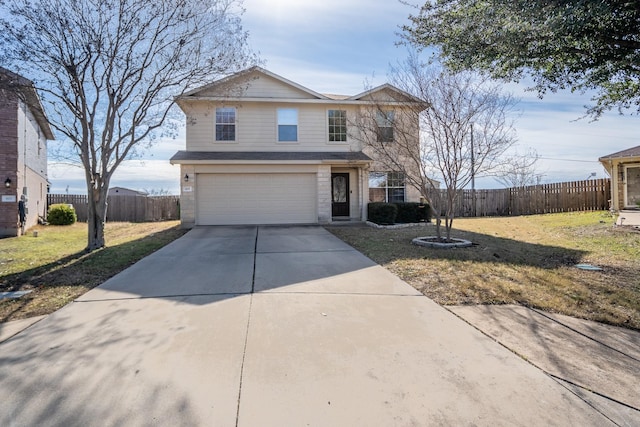 view of front of home featuring a front lawn and a garage