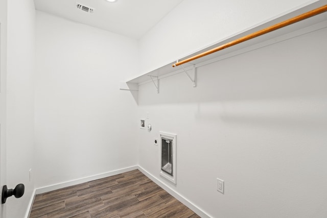 108 Kimo Ct, Bastrop, TX 78602 - washroom featuring washer hookup, dark wood-type flooring, baseboards, and electric dryer hookup
