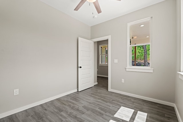108 Kimo Ct, Bastrop, TX 78602 - unfurnished room with ceiling fan, baseboards, wood finished floors, and a smoke detector