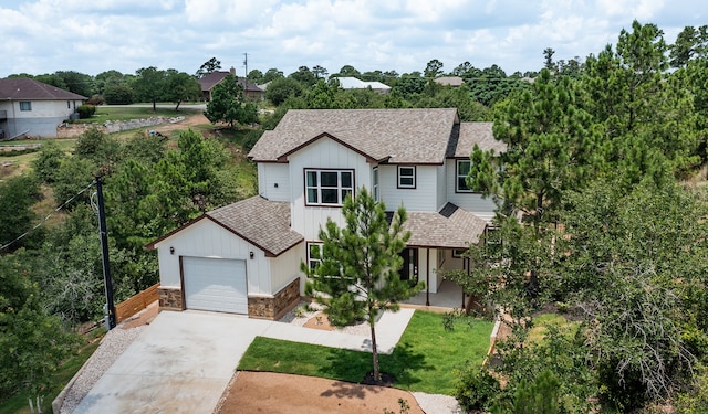 view of front of home with a front lawn and a garage