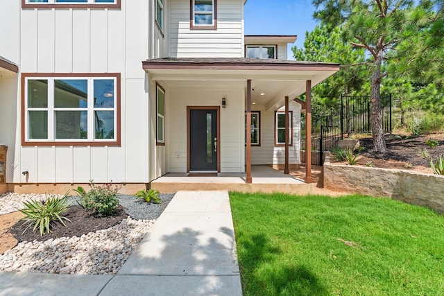 108 Kimo Ct, Bastrop, TX 78602 - view of exterior entry with board and batten siding and covered porch