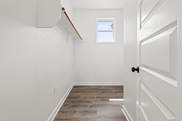 spacious closet with wood finished floors