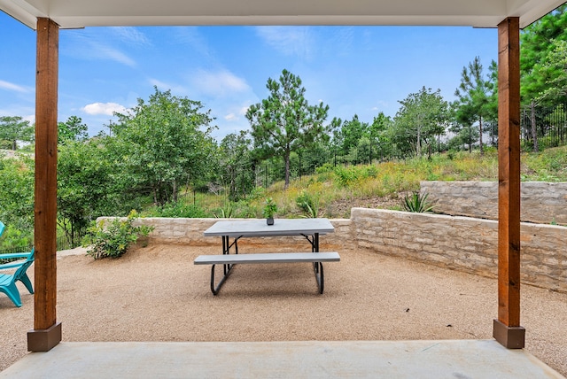 view of community featuring a patio and outdoor dining space