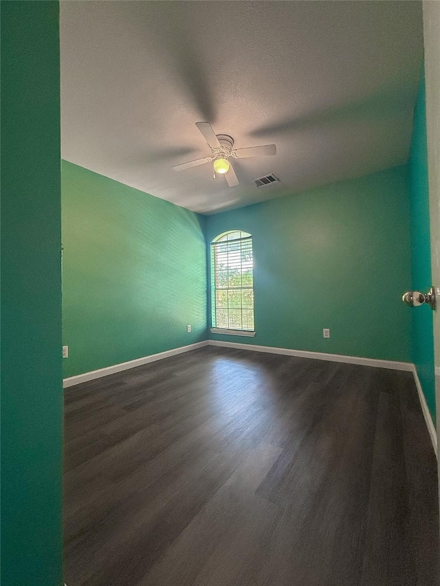 unfurnished room featuring a textured ceiling, ceiling fan, and hardwood / wood-style floors