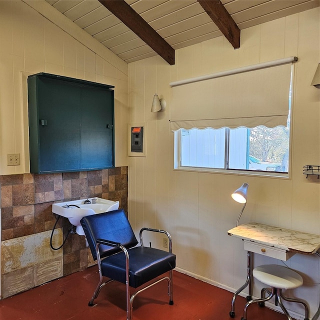 sitting room with wooden ceiling and vaulted ceiling with beams