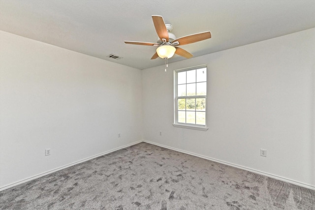 carpeted empty room with ceiling fan