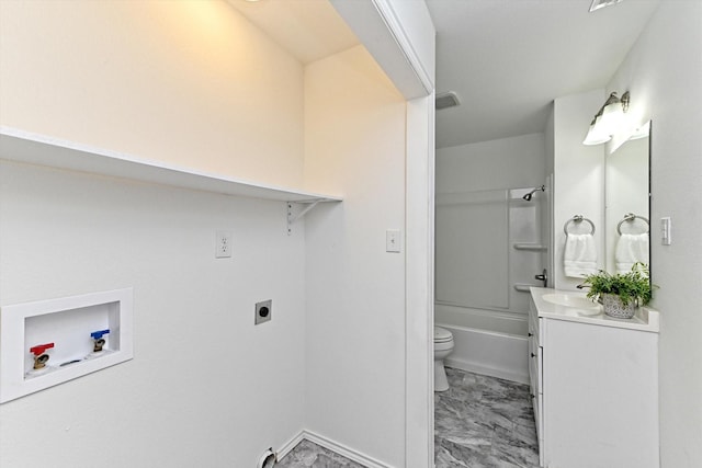 full bathroom featuring washtub / shower combination, toilet, and vanity