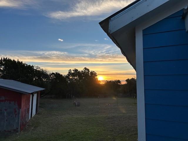 view of yard at dusk