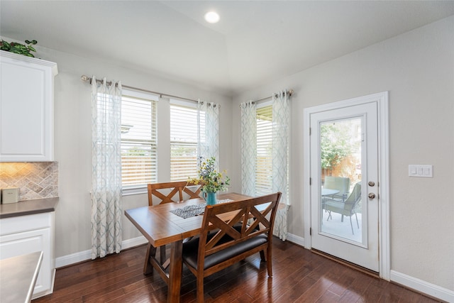 dining space featuring dark hardwood / wood-style flooring