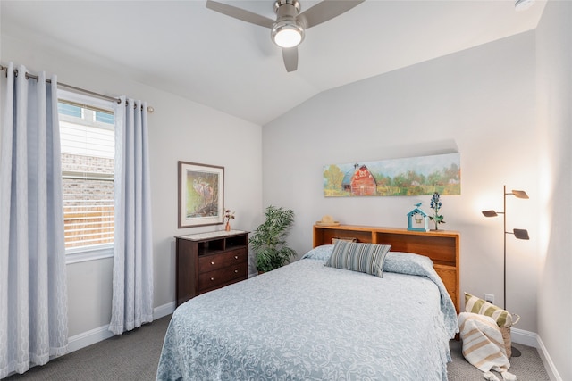 bedroom with ceiling fan, carpet flooring, and vaulted ceiling