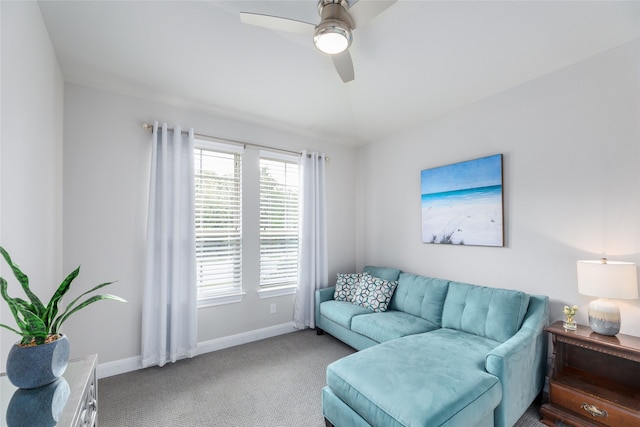 living room featuring ceiling fan and light colored carpet