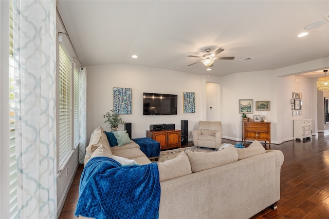 living room featuring ceiling fan, lofted ceiling, and dark hardwood / wood-style floors