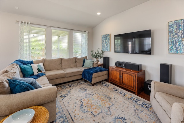 living room featuring hardwood / wood-style flooring and lofted ceiling