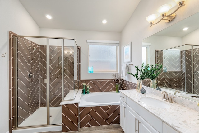 bathroom featuring vanity and plus walk in shower