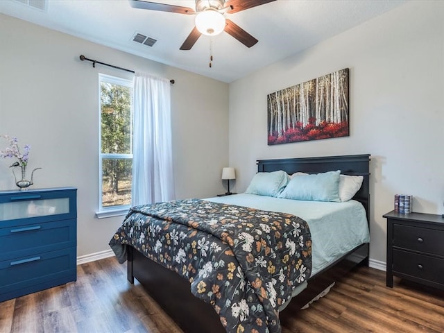 bedroom featuring ceiling fan and dark hardwood / wood-style floors