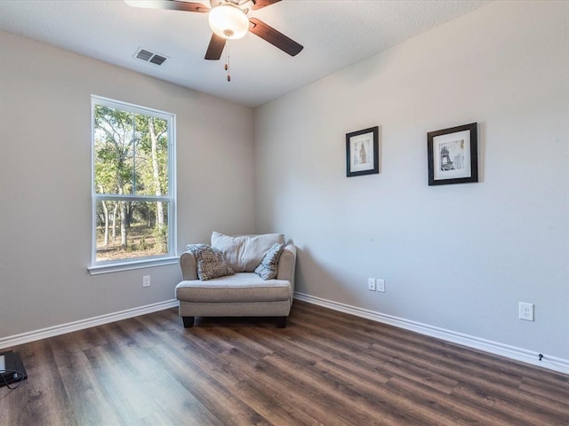 sitting room featuring ceiling fan and dark hardwood / wood-style floors