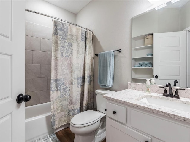 full bathroom featuring hardwood / wood-style floors, toilet, vanity, and shower / tub combo