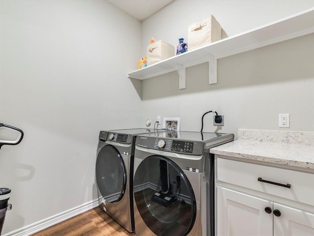 laundry room featuring dark hardwood / wood-style flooring and independent washer and dryer