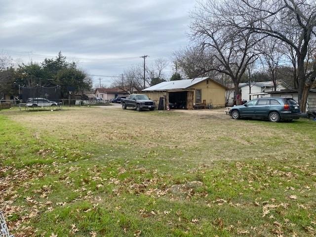 view of yard with a trampoline