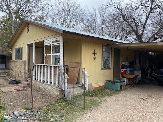 exterior space featuring a carport