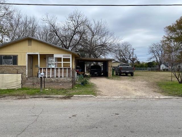 bungalow-style house with a carport and a porch