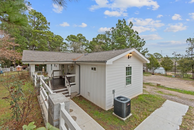 view of front of house with central AC and a porch