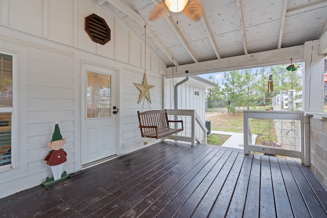 wooden deck featuring ceiling fan