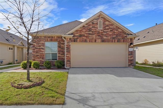 view of front property with a front yard and a garage