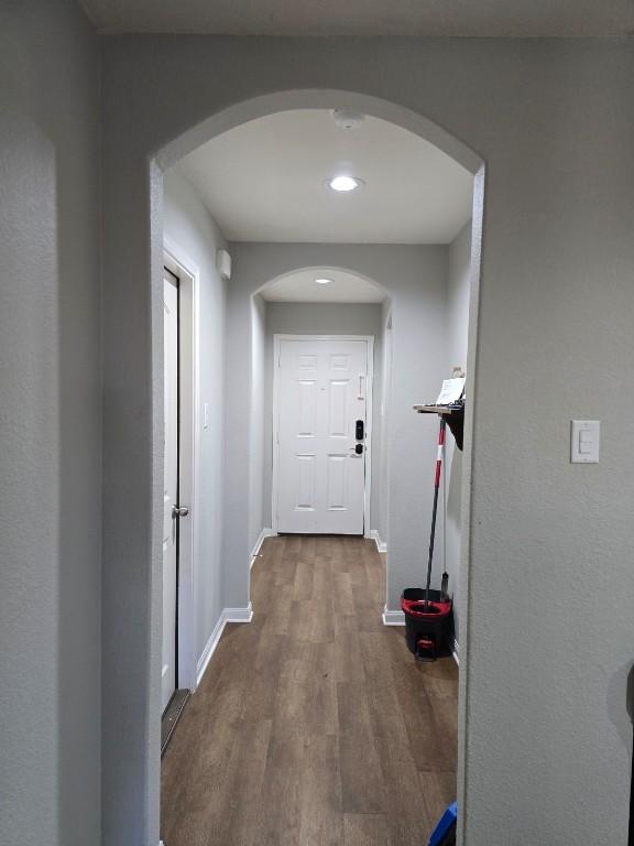 hall with dark wood-type flooring