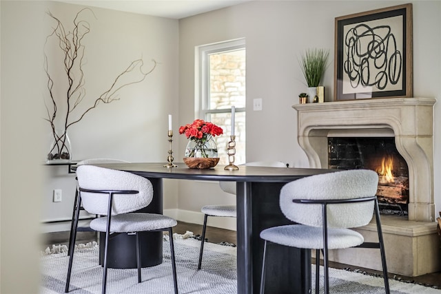 interior space featuring a high end fireplace and hardwood / wood-style flooring