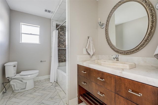 full bathroom with toilet, vanity, and shower / tub combo with curtain