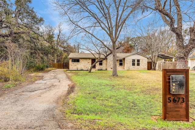 ranch-style house with a front lawn