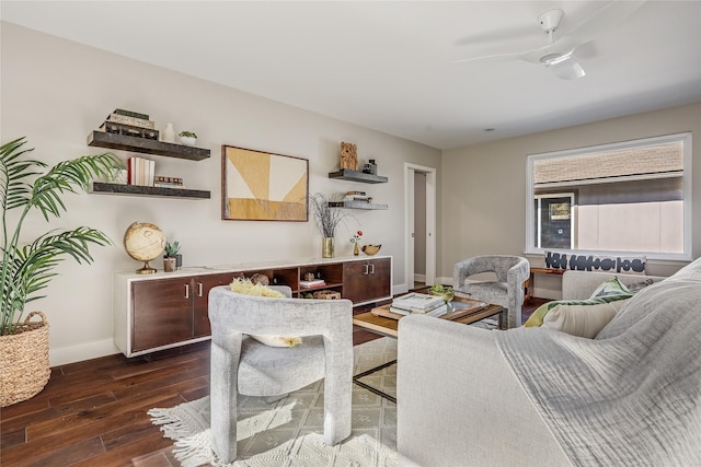 living room with ceiling fan and dark hardwood / wood-style floors