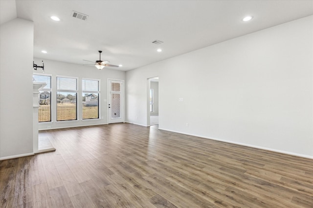 unfurnished living room featuring ceiling fan and hardwood / wood-style floors