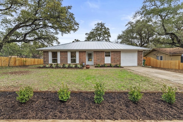 single story home featuring a garage and a front lawn