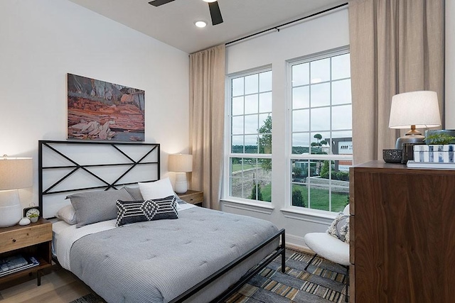 bedroom featuring ceiling fan and wood-type flooring