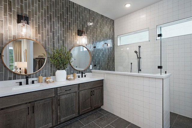 bathroom with tile walls, walk in shower, and tile patterned flooring