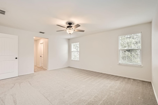 carpeted empty room with ceiling fan