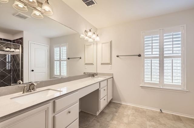 bathroom with vanity and an enclosed shower