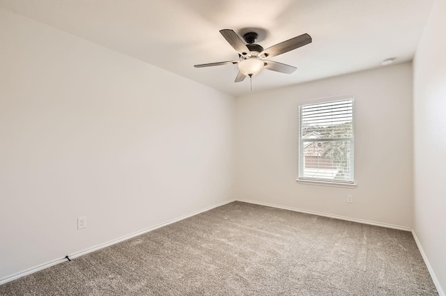 empty room featuring ceiling fan and carpet floors