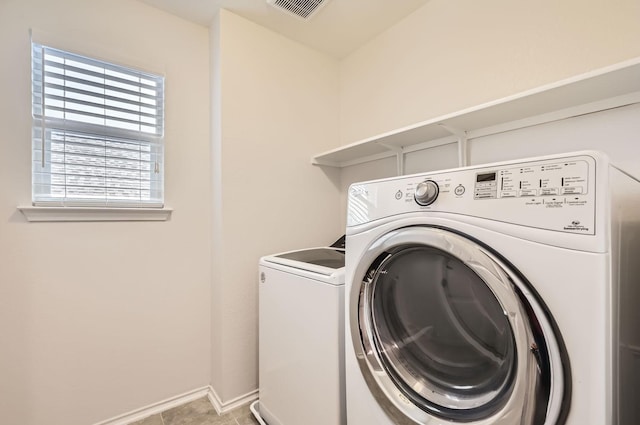 laundry area with washing machine and dryer