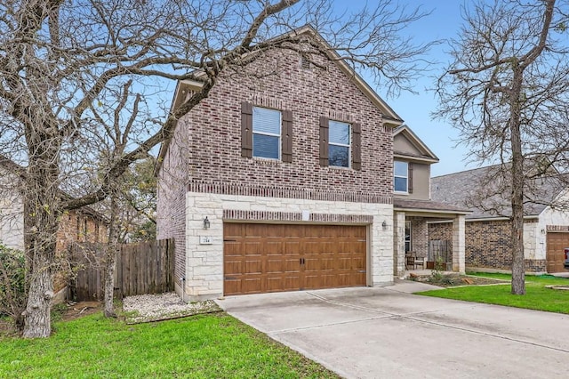 view of property with a garage and a front yard