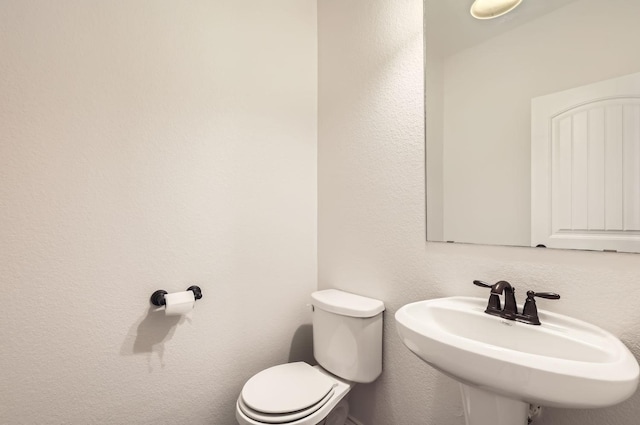 bathroom with sink and toilet