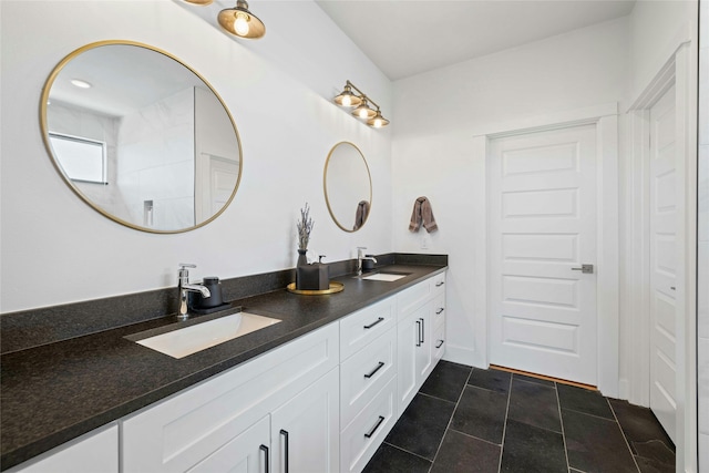 bathroom with tile patterned floors and vanity