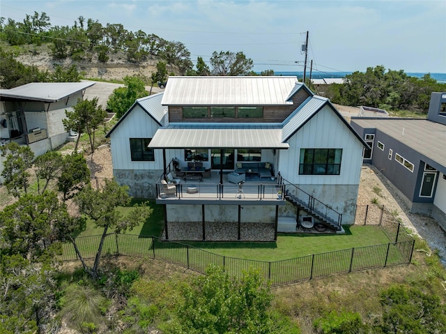 rear view of house with a lawn