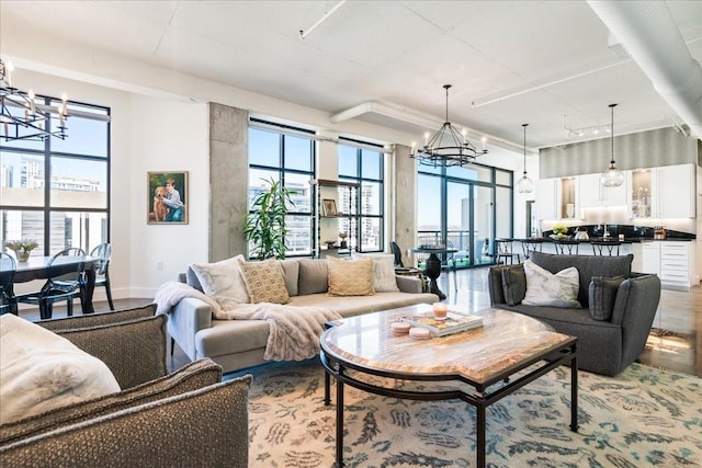 living room with a chandelier and plenty of natural light