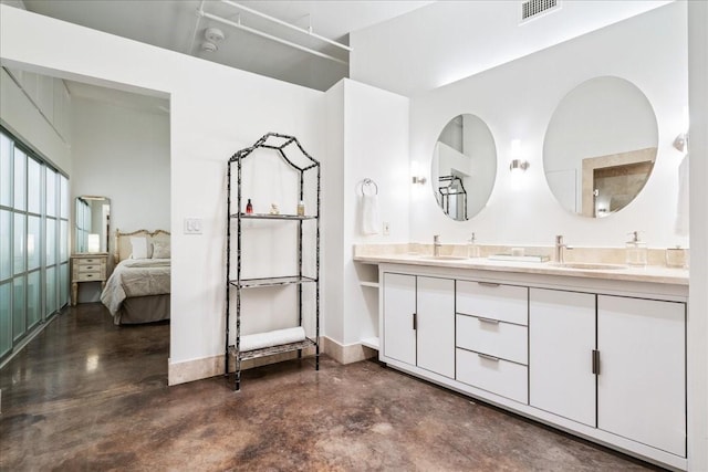 bathroom with concrete flooring and vanity