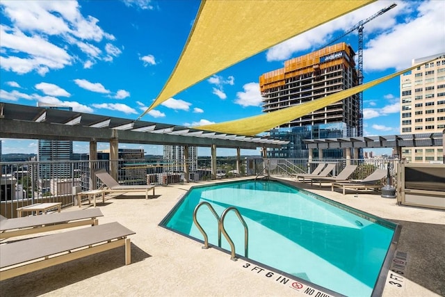 view of swimming pool featuring a patio area