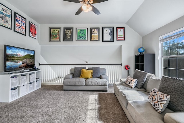 carpeted living room featuring vaulted ceiling and ceiling fan