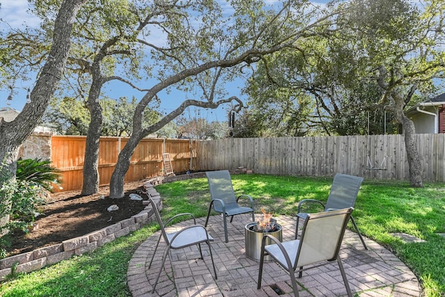 view of patio featuring a fire pit